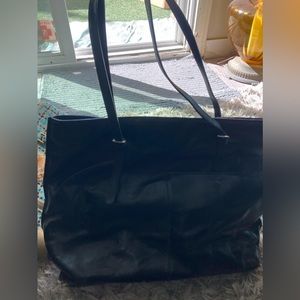 HOBO brand black leather large tote bag. Big outside pocket. Interior 4 pockets